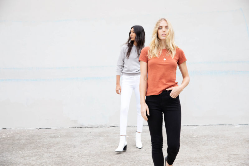 Women modeling Industry Standard clothing from afar